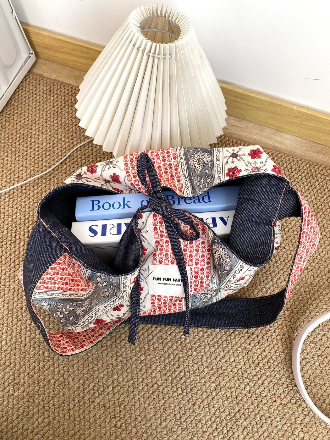 Cosbai bag folded to show reversible feature with contrasting patchwork