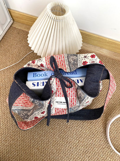 Cosbai bag folded to show reversible feature with contrasting patchwork