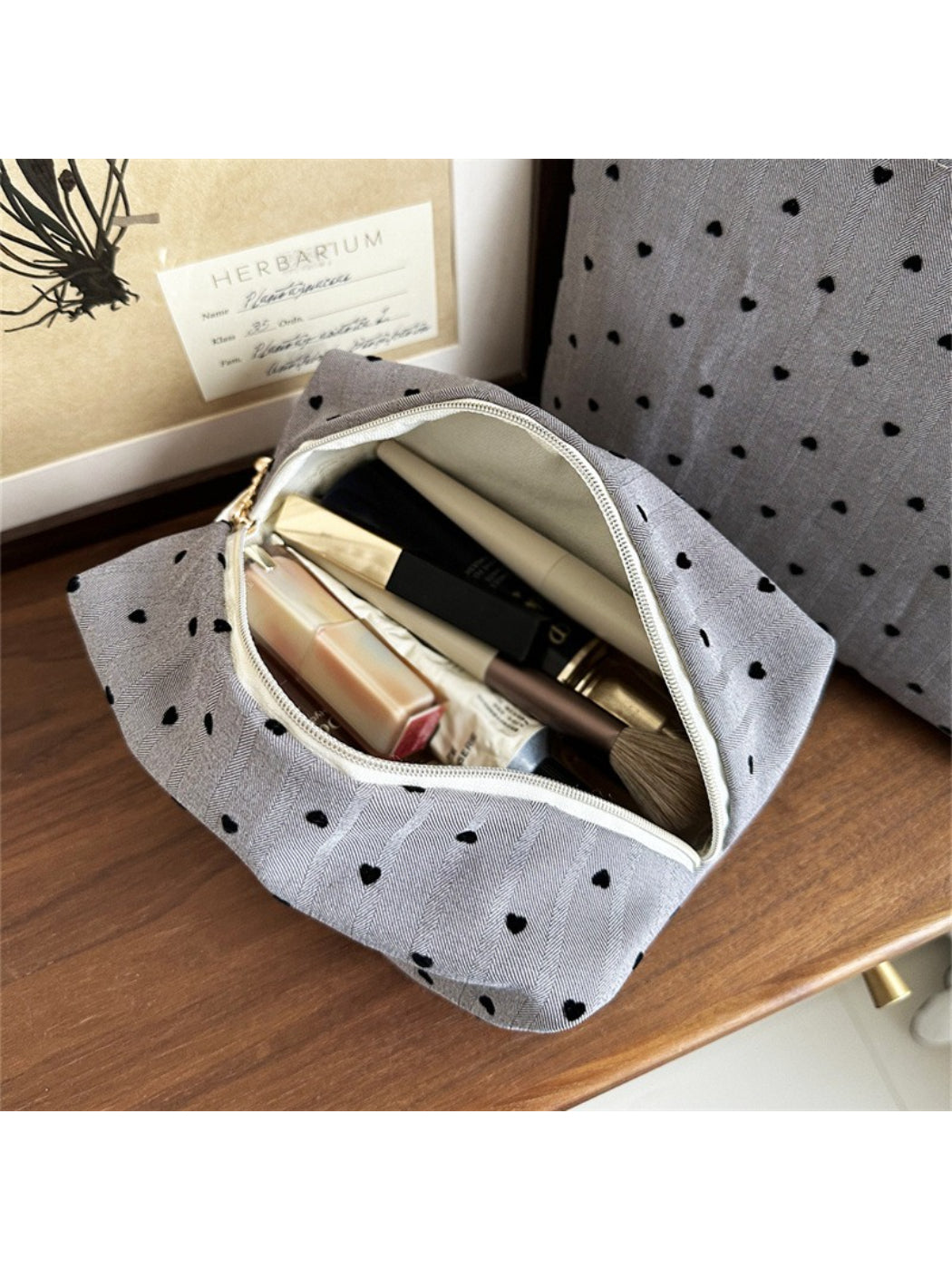 Cosbai Everyday Minimal Heart Makeup Pouch held in hand for size reference