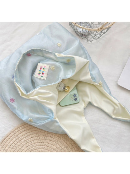 Cosbai Pastel Daisy Slouch Tote Bag hanging by handles on white background