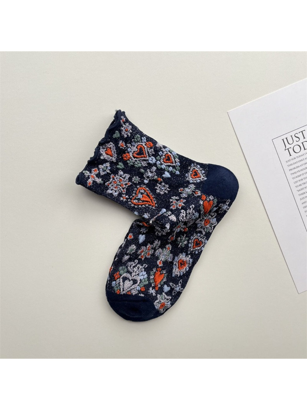 Close-up of Rufia Heart White Mid-Calf Socks fabric texture and heart design