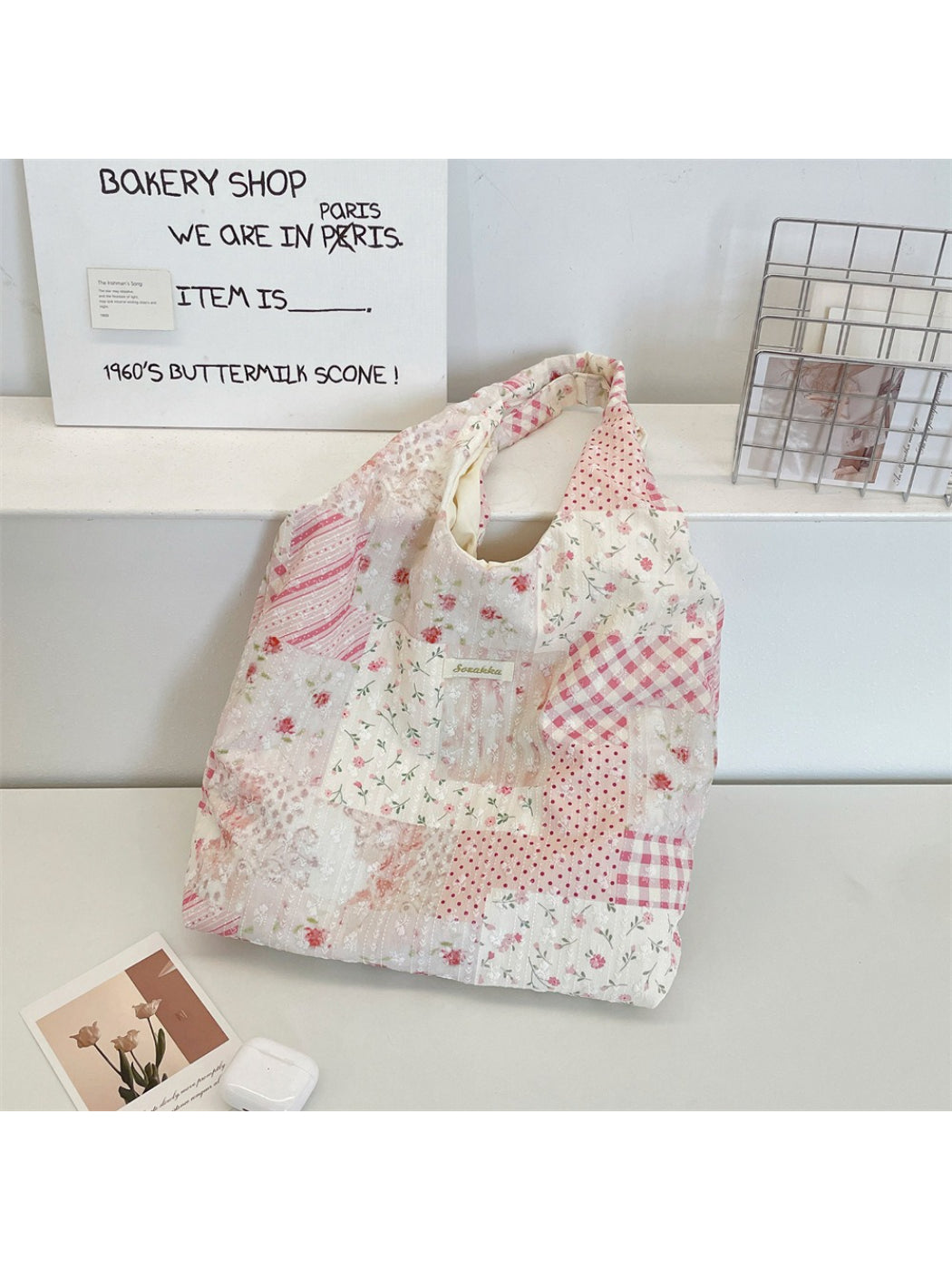 Close-up of Cosbai tote showing detailed floral patchwork and stitching on fabric