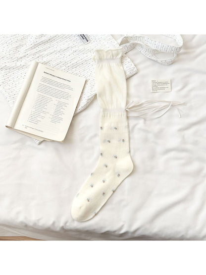 Model wearing Rufia Soft Bloom Ruffle Crew Socks paired with casual shoes and rolled-up jeans