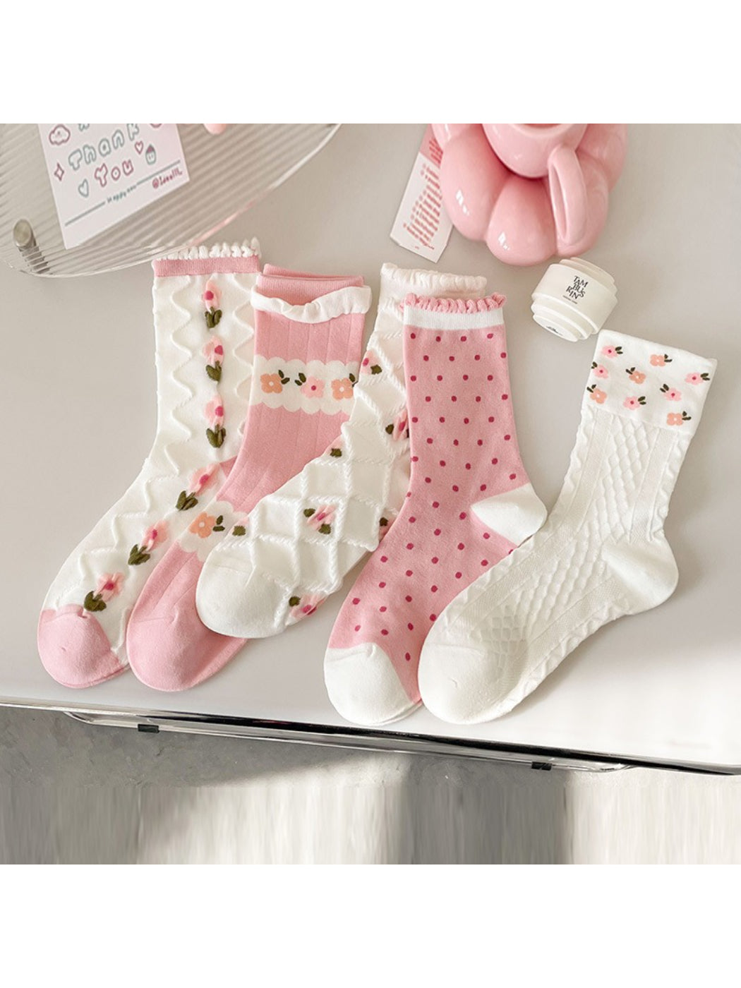 Close-up of Rufia pink floral ribbed crew sock showing ribbed texture and flower pattern