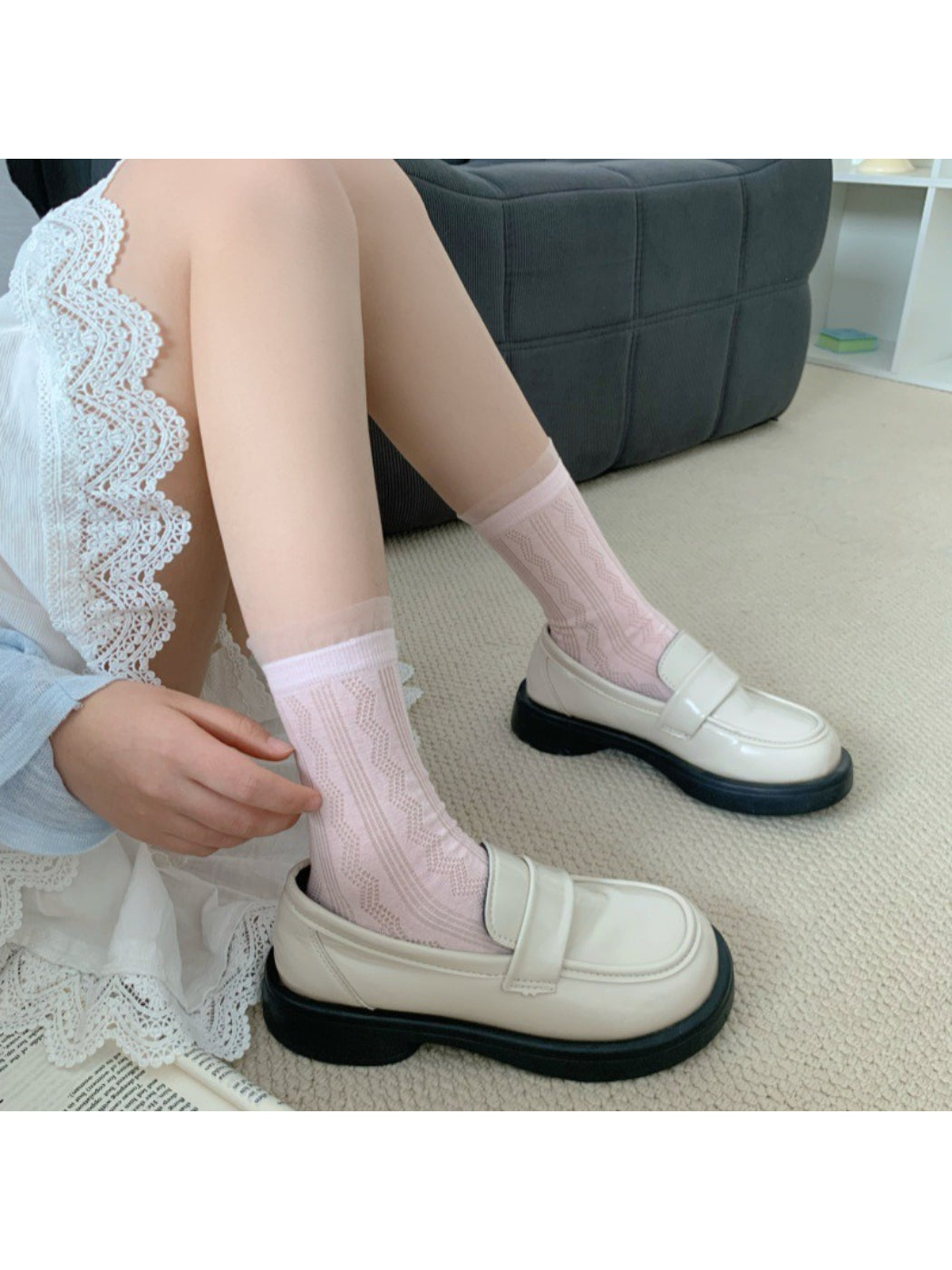 Close-up of Rufia sheer wave pattern on beige crew sock fabric