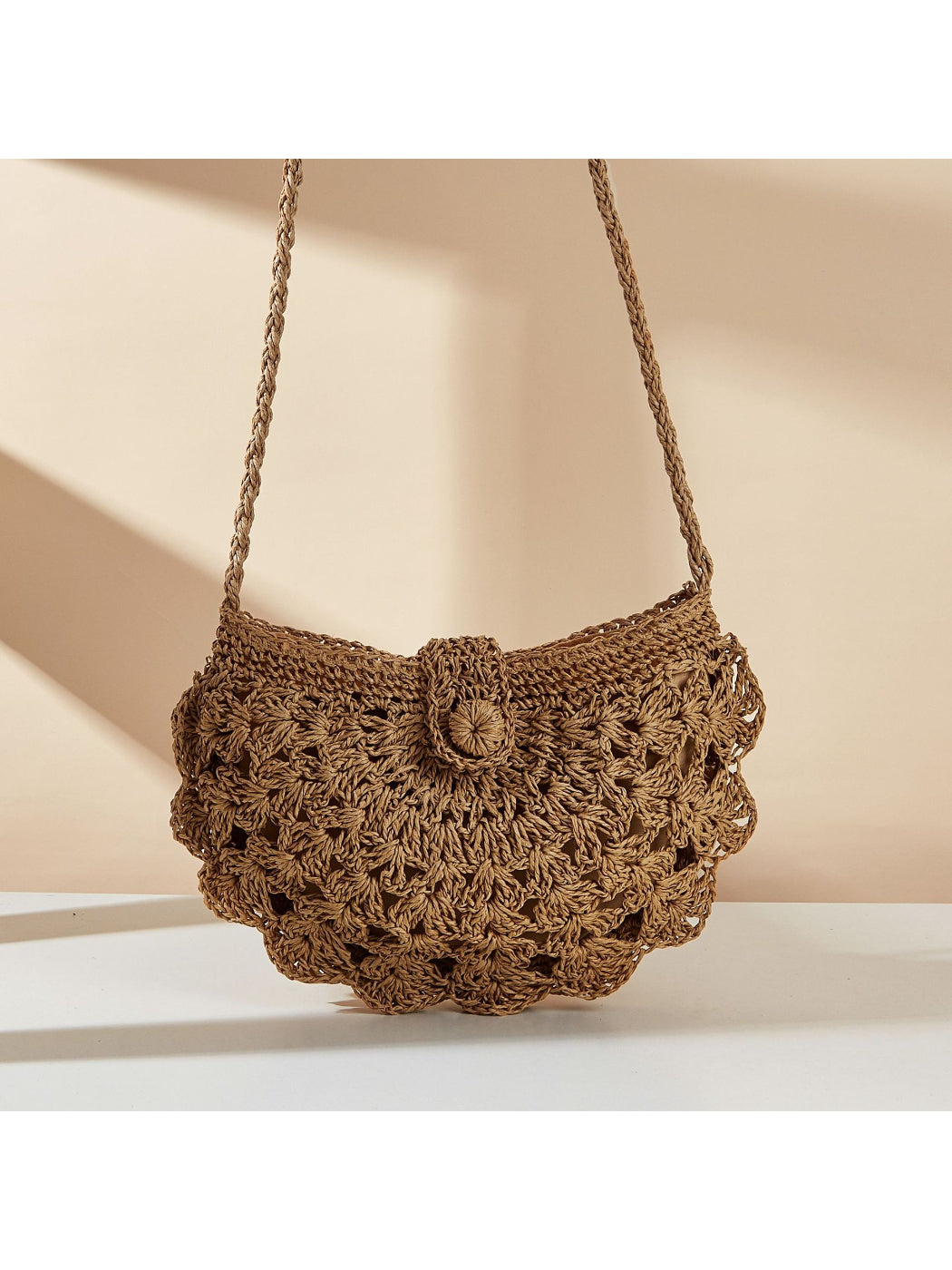 Side view of Cosbai Boho shell shape crossbody bag showing curved silhouette