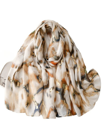 Soft marble print scarf in neutral tones displayed flat on a white background