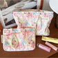 Cosbai cosmetic bag featuring a bow and floral design on a light background