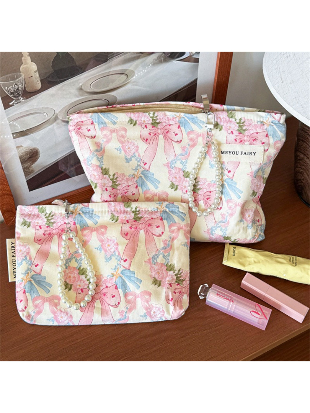 Cosbai cosmetic bag featuring a bow and floral design on a light background