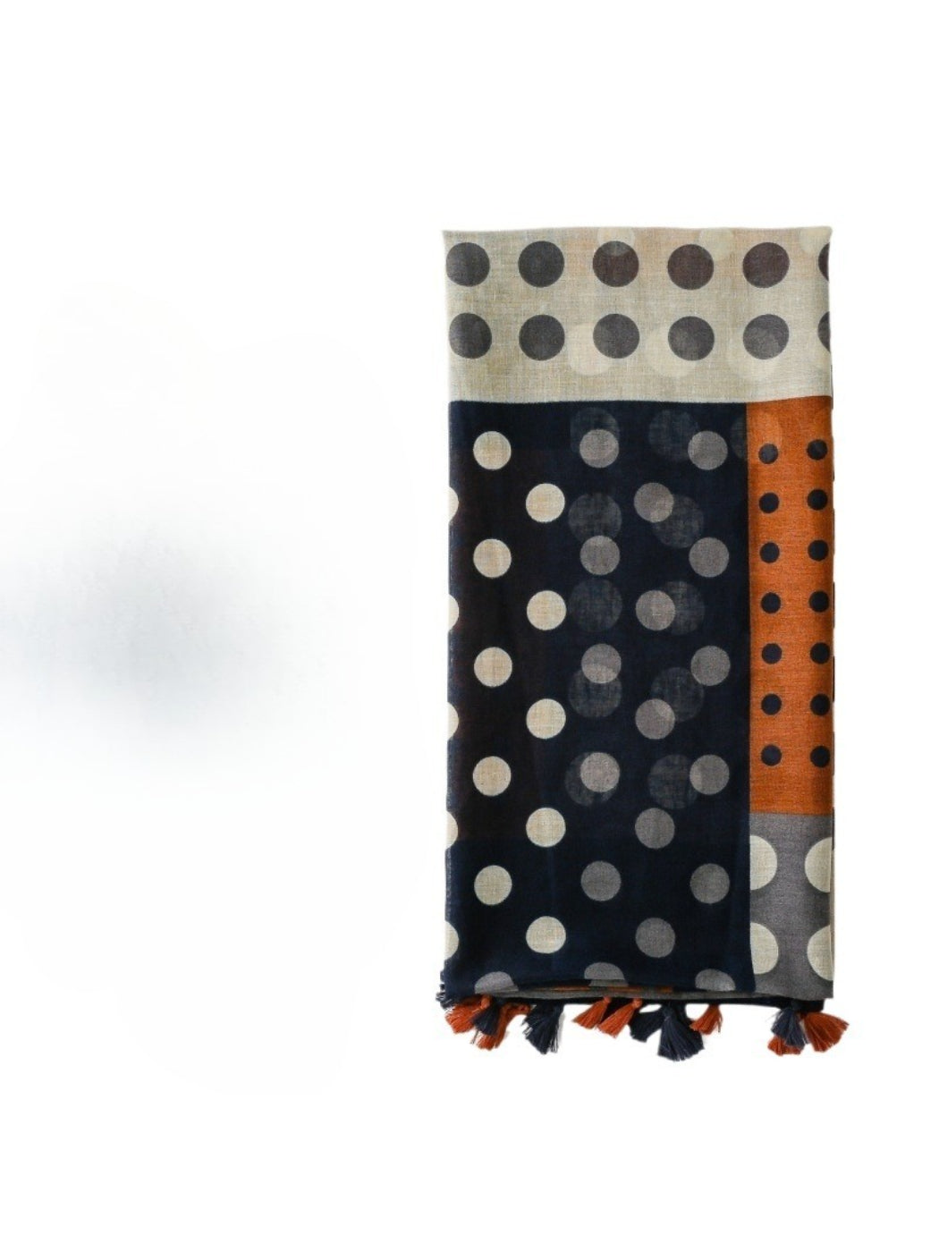 Close-up of Scarvii scarf fabric showing black and white spot pattern and colourblock design