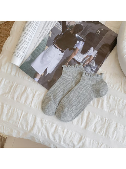 Rufia ankle socks paired with casual shoes, showing fit and trim detail