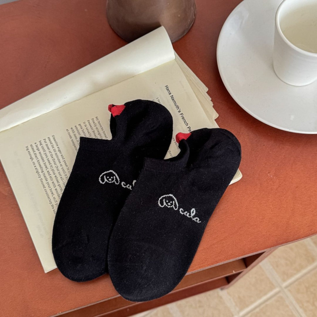 Rufia Soft Spot low cut socks in a stack showing multiple pairs in white