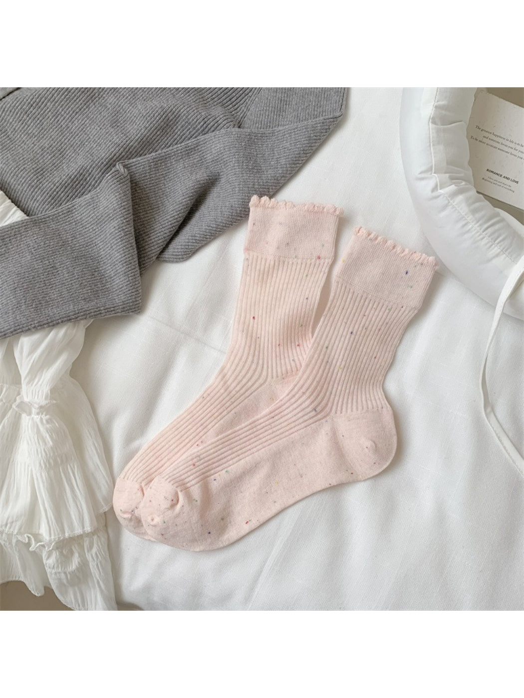 Rufia rib crew socks worn with rolled-up pants to showcase speckled knit texture