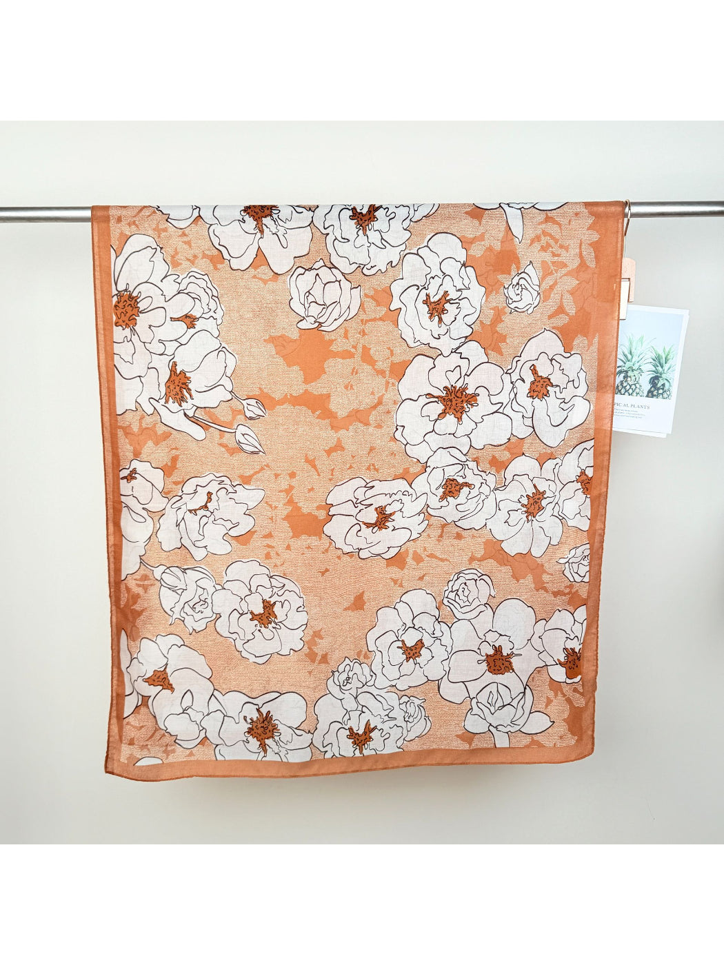 Model styling Scarvii Statement Flower Wrap Scarf as a head wrap with bold flower print