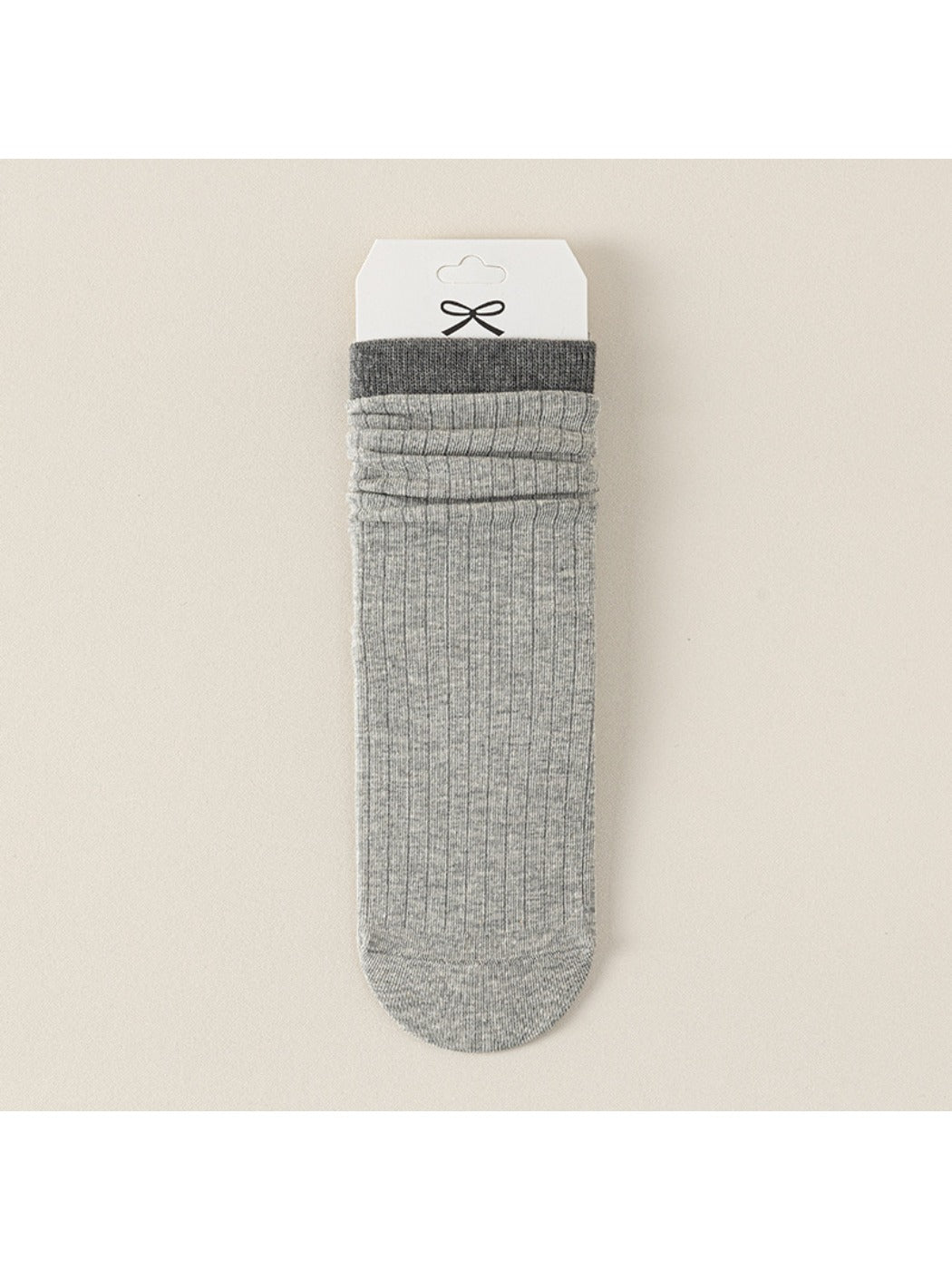Close-up of black Rufia ribbed mid-calf sock showing ribbed texture and toe seam