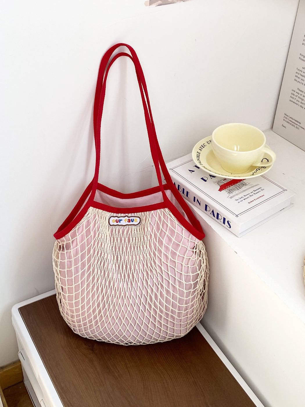 Cosbai beach tote bag filled with beach essentials including towel and sunscreen