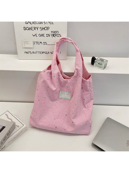 Cosbai star pattern tote bag displayed hanging by handles