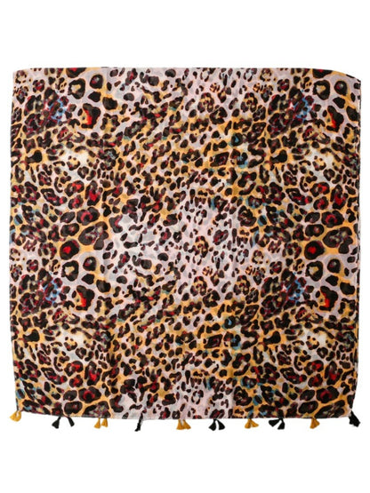 Model wearing Colour Splash Leopard Tassel Scarf styled around the neck with tassels visible