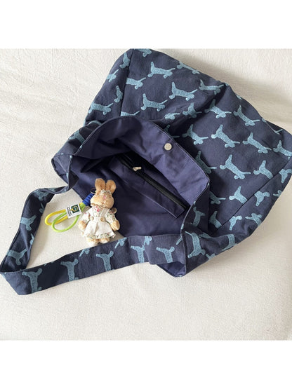 Cosbai oversized hobo bag displayed on wooden surface with rabbit print