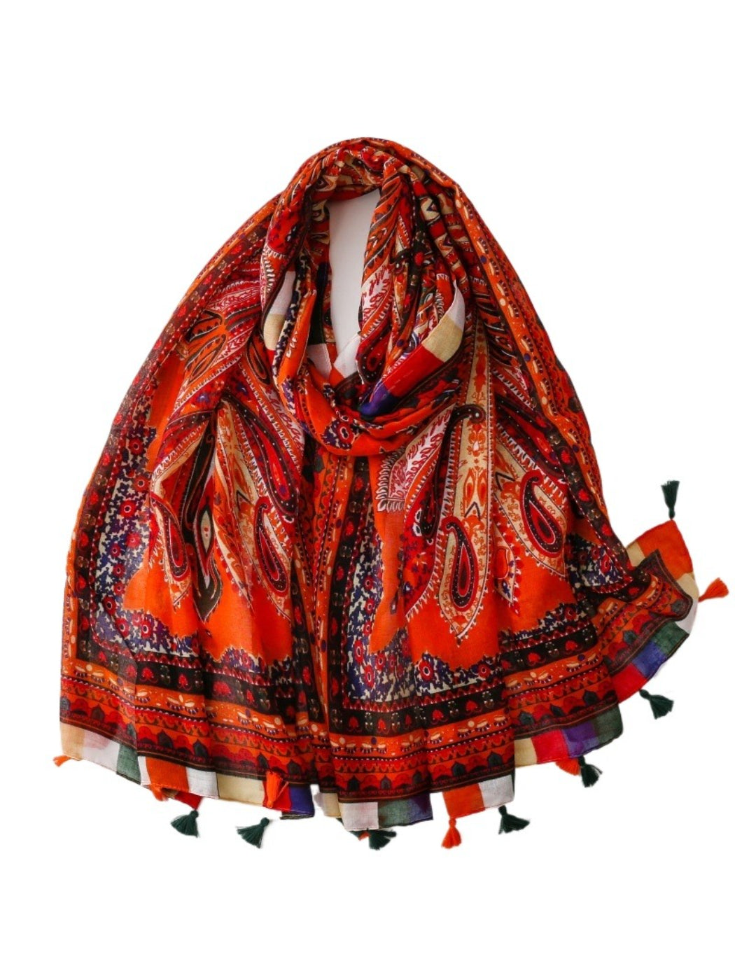 Close-up of scarf fabric showing detailed paisley pattern and tassels