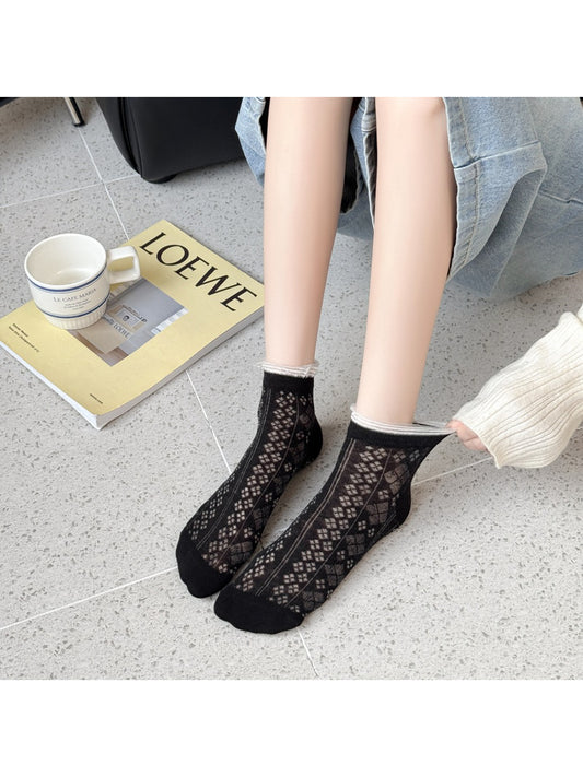 Close-up of Rufia fine pointelle socks showing delicate knit pattern and texture
