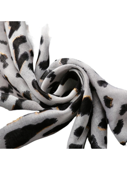 Snow leopard print scarf styled with casual outfit on model