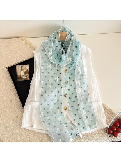 Scarvii sheer scarf with white stars displayed with matching black outfit
