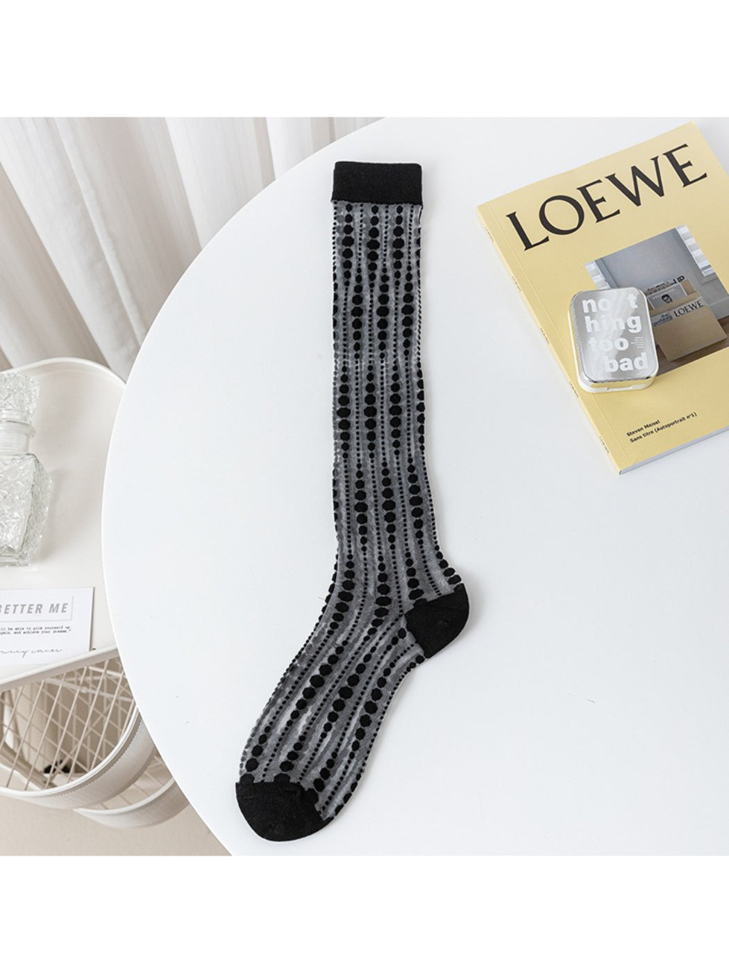 Pair of Rufia lace floral knee high socks displayed flat on white background