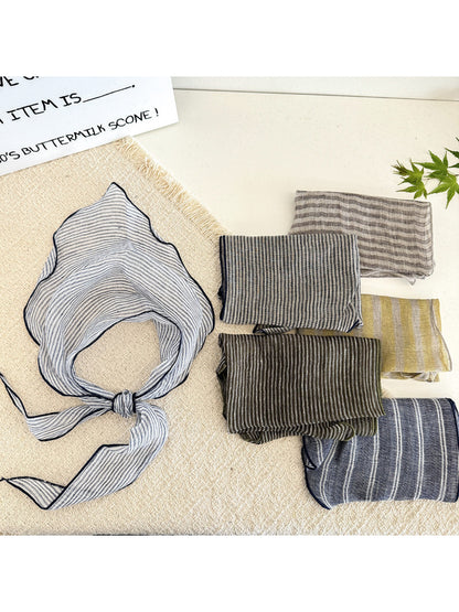 Soft textured stripe head scarf in neutral tones styled on a mannequin