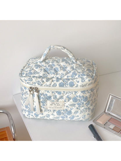 Close-up of Cosbai blue floral quilted vanity bag showing detailed stitching and floral design