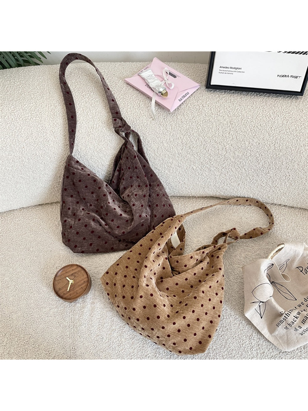 Side angle of Cosbai Polka Dot Crossbody Slouchy Bag showing slouchy shape and strap