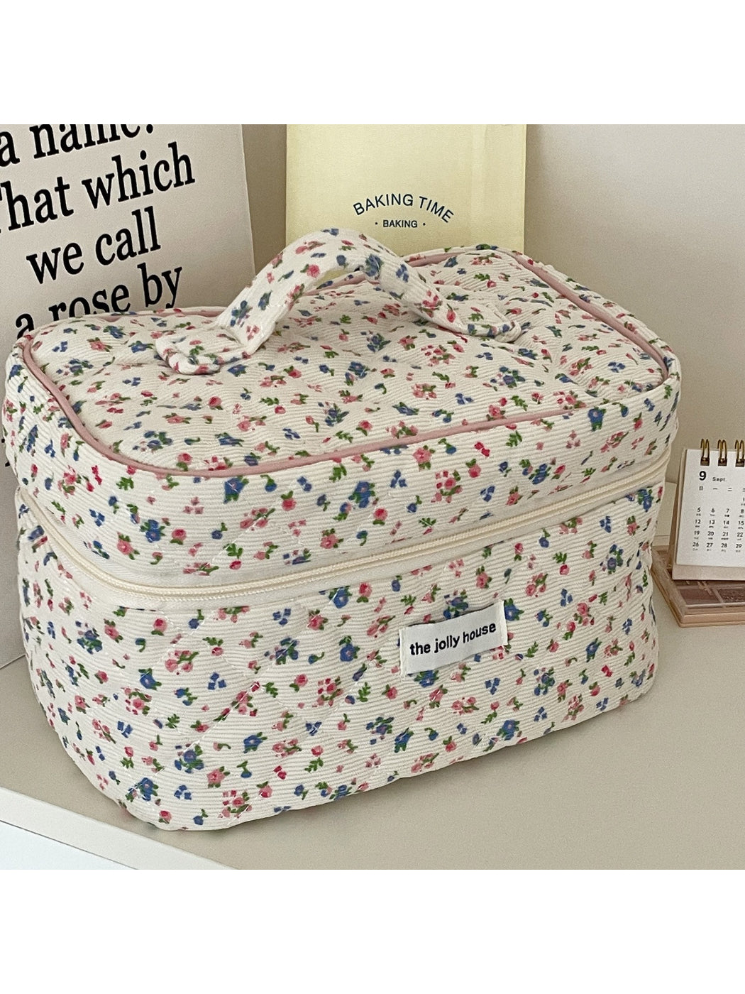 Open Cosbai floral quilted travel makeup bag showing interior