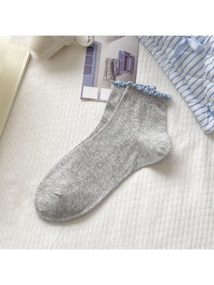 Side view of Rufia Simple Colour Edge Crew Socks highlighting red edge