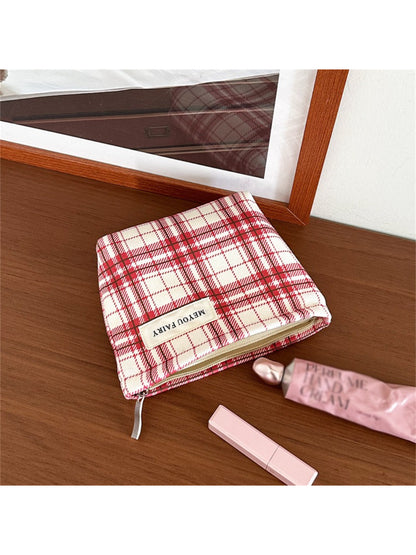 Side view of Cosbai red plaid cosmetic bag highlighting its shape and plaid design