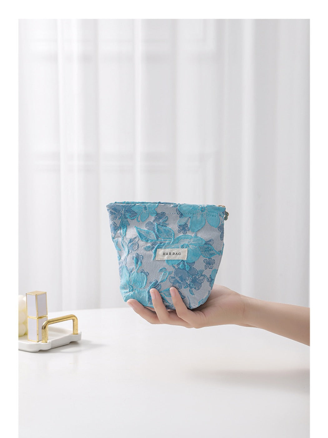 Side view of Cosbai floral cosmetic bag highlighting its shape and floral design