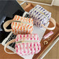 Cosbai woven stripe cosmetic bag with horizontal multicolor stripes on a white background