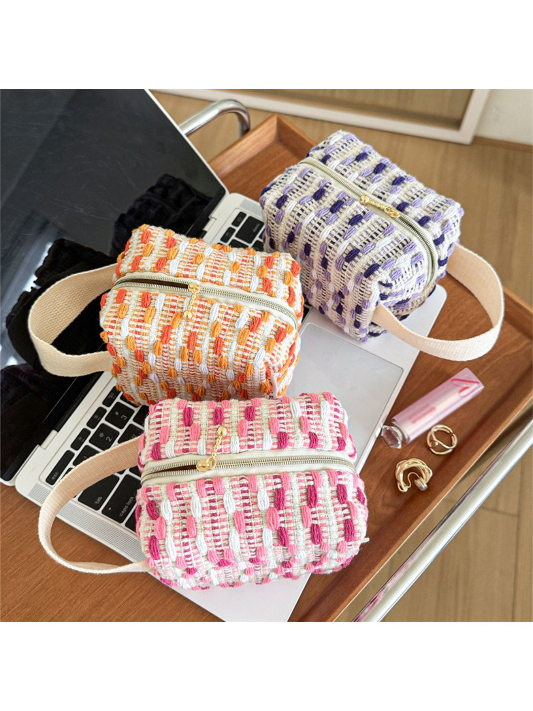 Cosbai woven stripe cosmetic bag with horizontal multicolor stripes on a white background