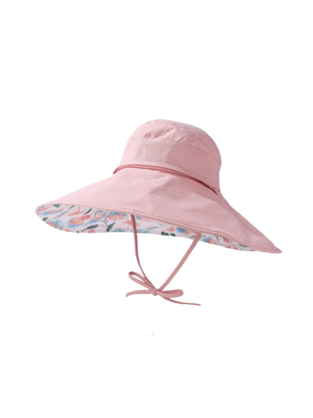 Model wearing Haila floral reversible wide brim hat outdoors