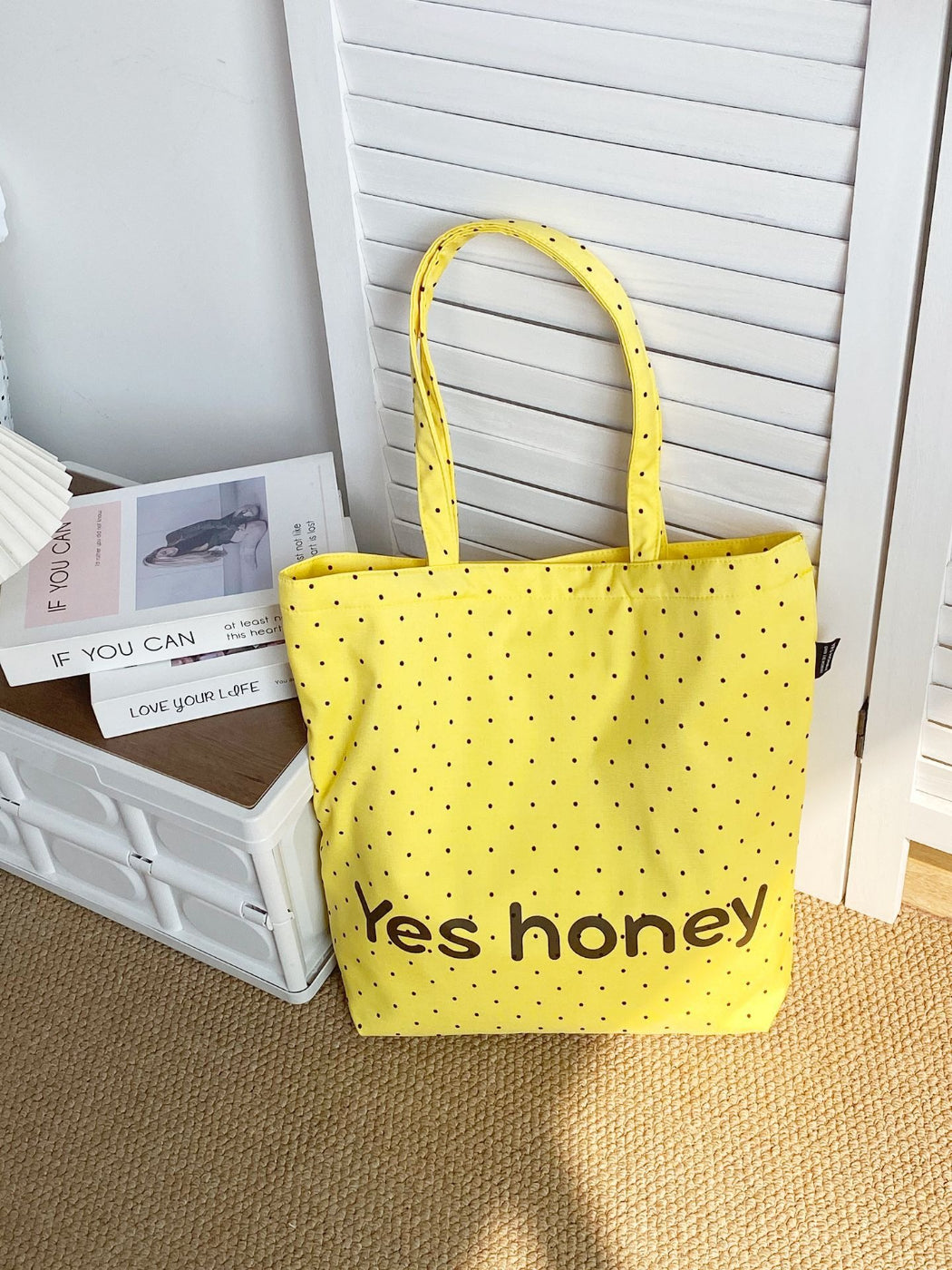 Cosbai Dot Print Graphic Tote Bag hanging on a hook with visible handle details