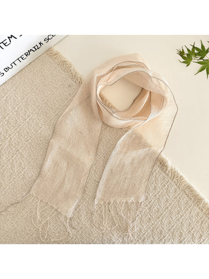 Close-up of scarf edges showing neat stitching on sheer solid summer scarf