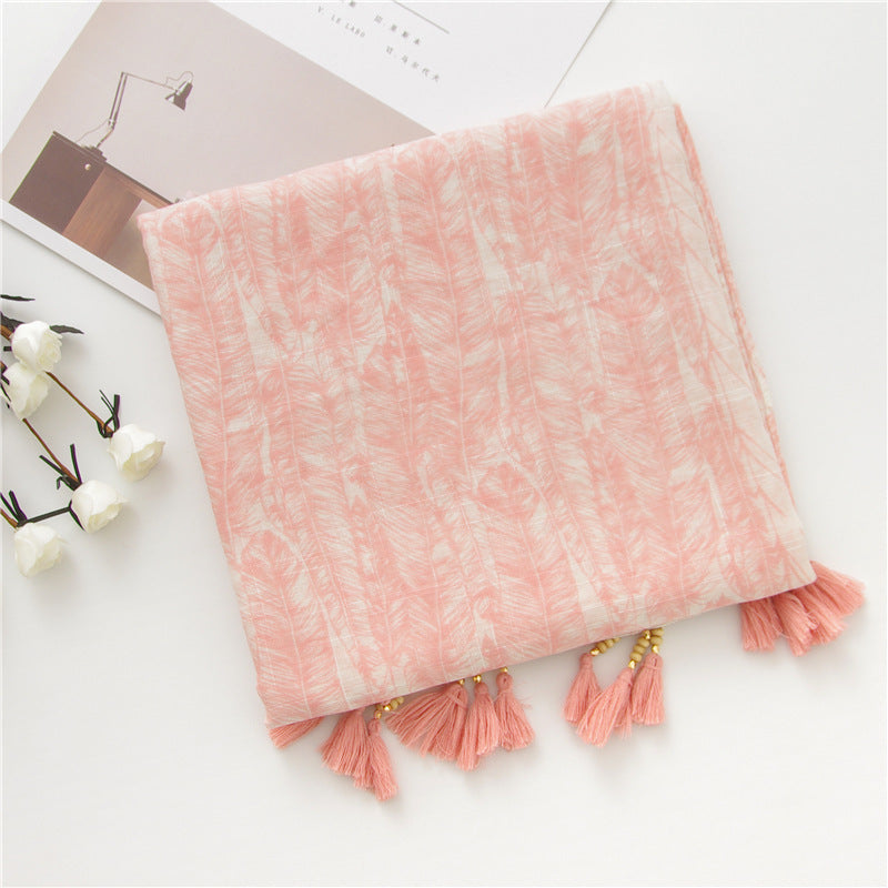 Pink feather print shawl and tassel detail
