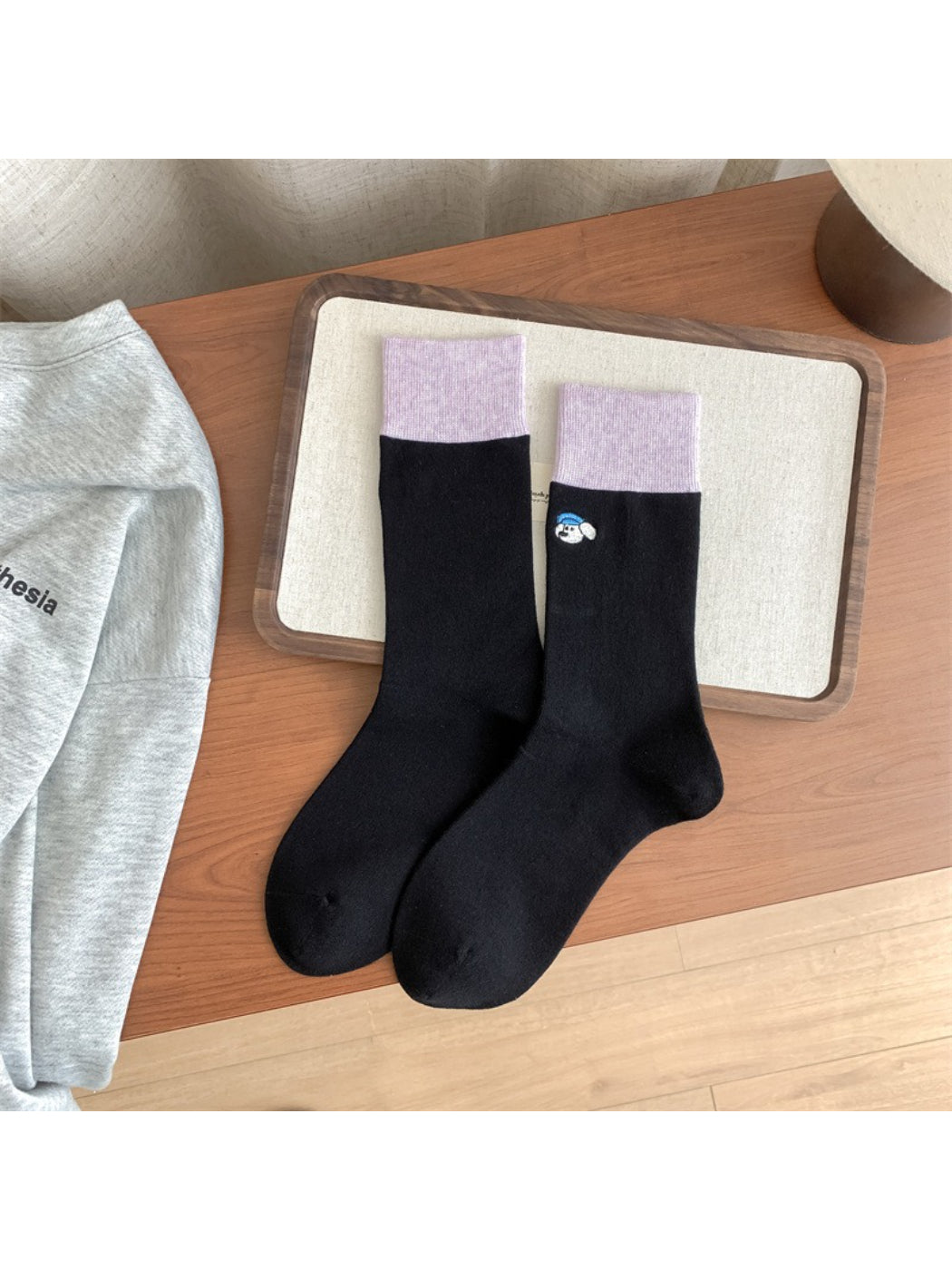 Model wearing Rufia soft crew socks with visible cute animal detail on side