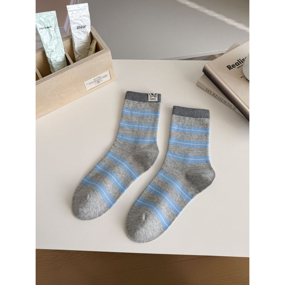 Rufia socks laid flat showing full length and contrasting stripes
