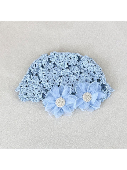Top view of Haila openwork hat highlighting floral design and airy knit pattern