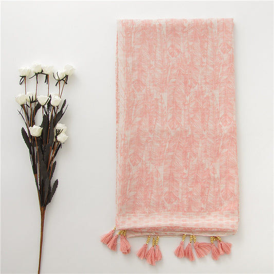 Folded pink feather print shawl with beaded tassels