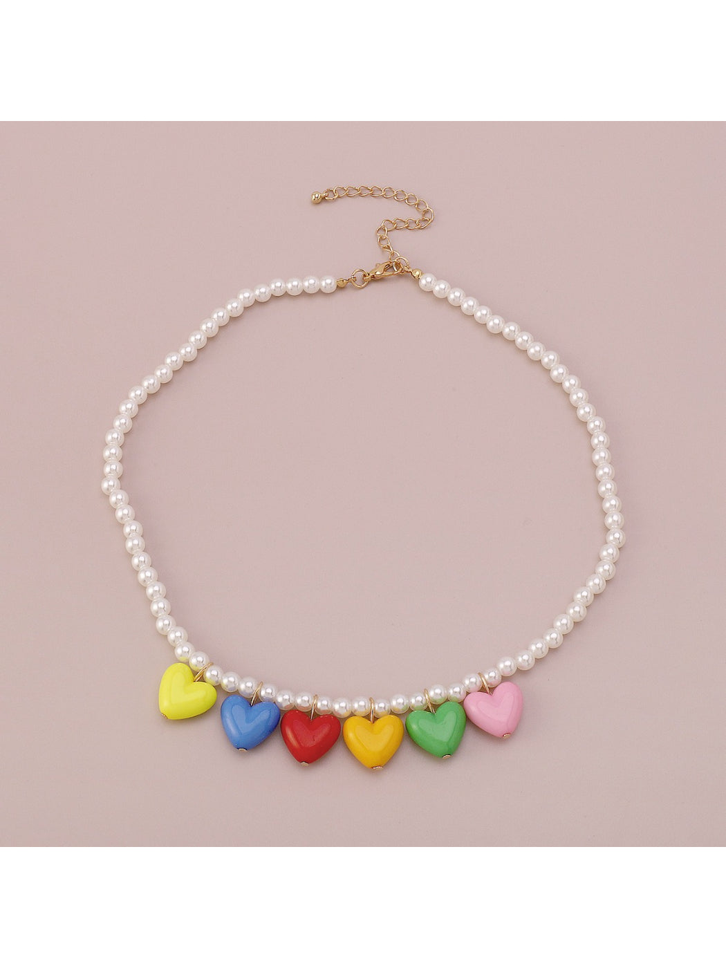 Neckit necklace with multicoloured heart charm worn on a model's neck
