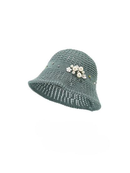 Haila beaded flower accent bucket hat shown in natural lighting