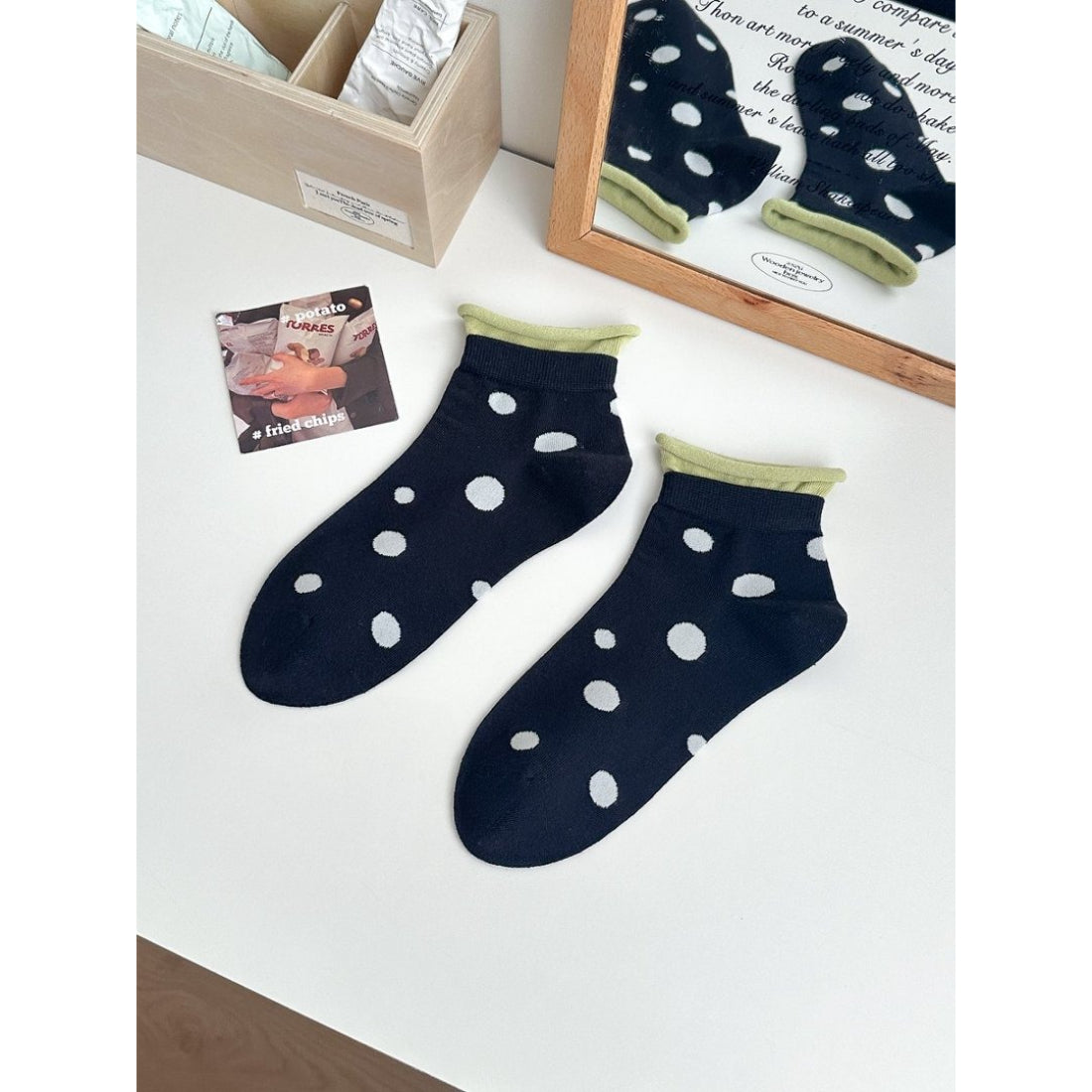 Rufia Soft Spot Pattern Crew Socks displayed on a wooden surface with natural lighting