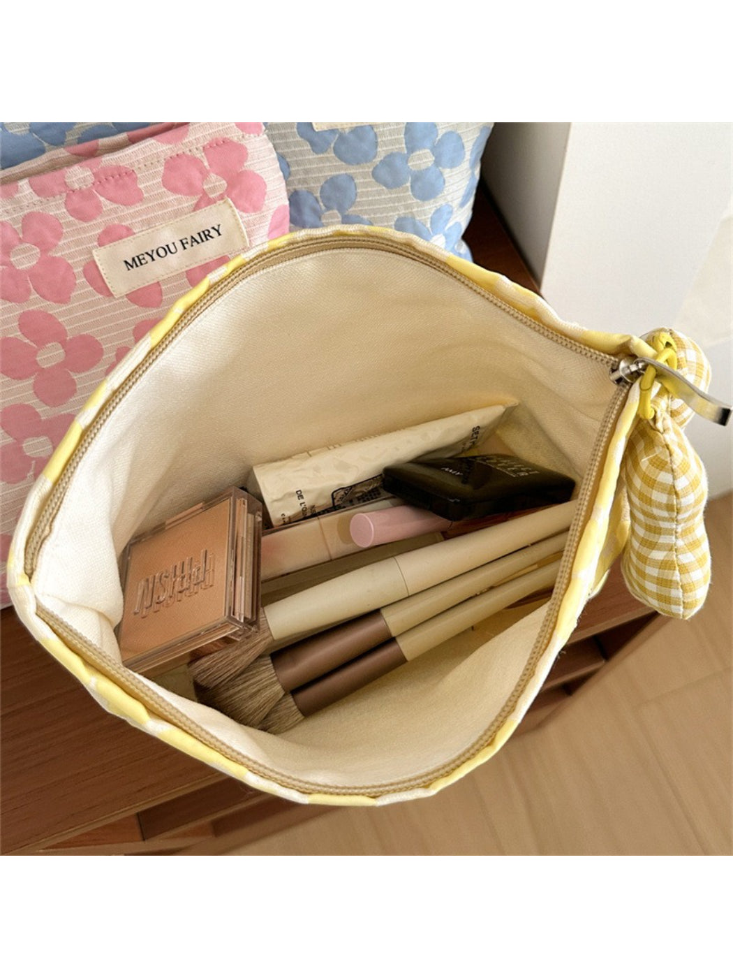 Cosbai floral cosmetic pouch folded flat, showing compact and lightweight design