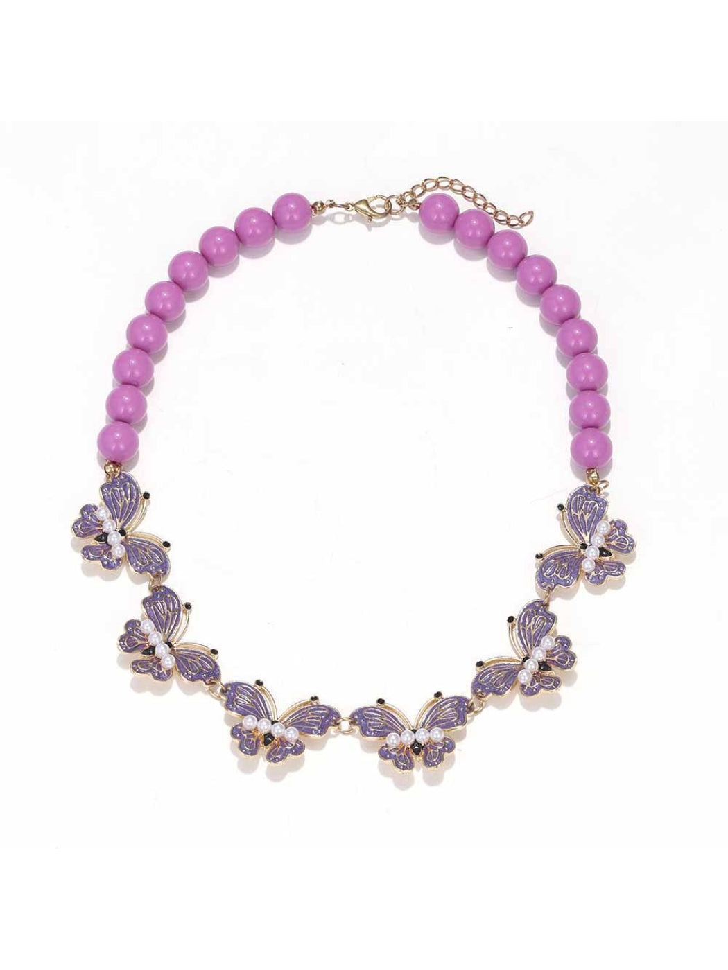 Neckit Butterfly Necklace with beaded detail laid flat with a blurred background